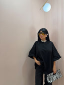 Maxi t-shirt nera con orlo