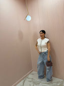 Jeans risvolto in vita e strappi