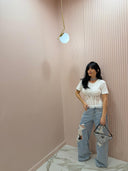 Jeans strappi e pizzo