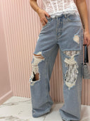 Jeans strappi e pizzo