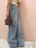 Jeans risvolto in vita e strappi